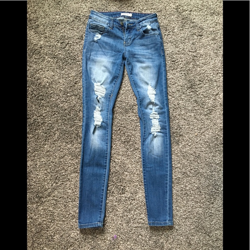 Distressed denim jeans